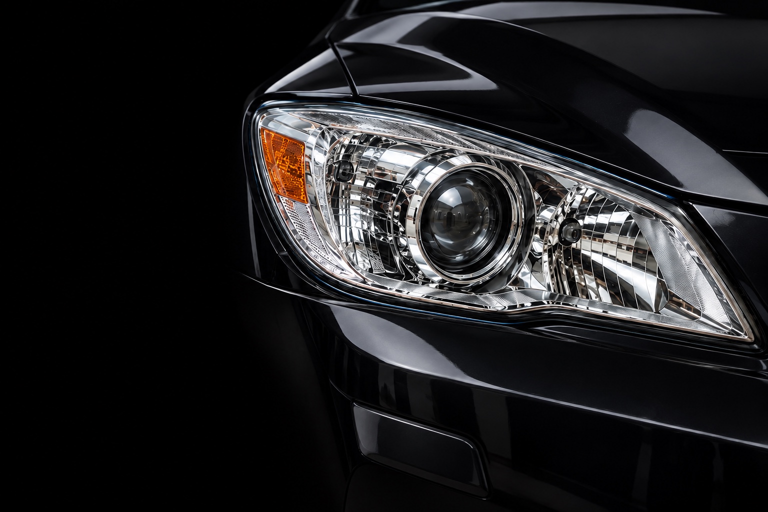 Clear headlight lens with a visible projector, chrome reflectors and amber indicator